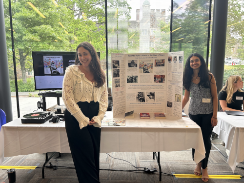 Santanam and Frankfort stand in front of the Bass Connections team's interactive display at the Fortin Foundation Bass Connections Showcase