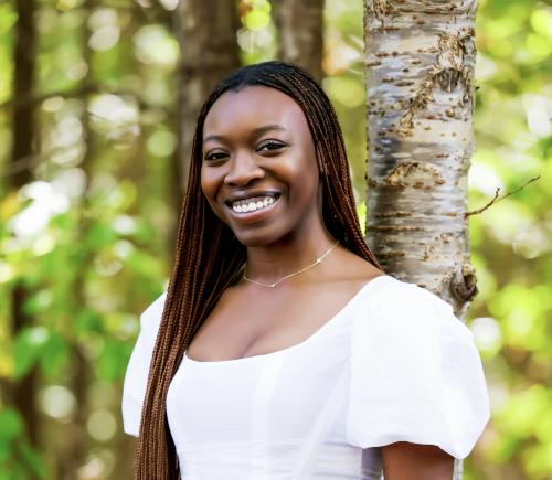 Portrait headshot of student standing outdoors